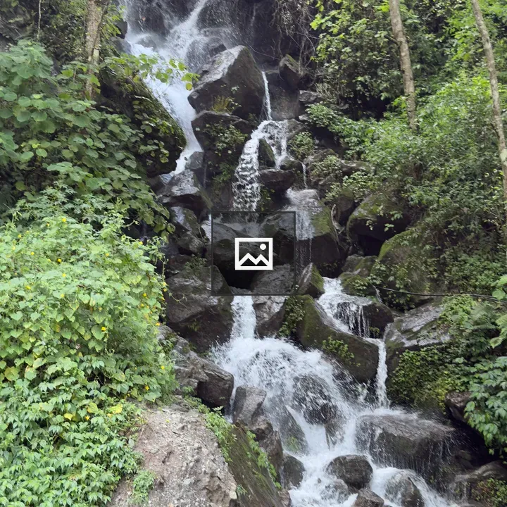 Waterfall Over Rock Cliff