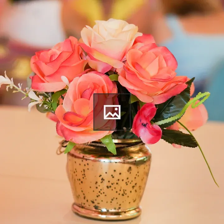 Bouquet of artificial roses in vase
