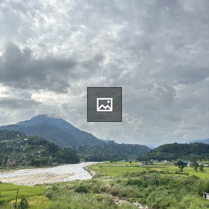 Greenery field with river and hills