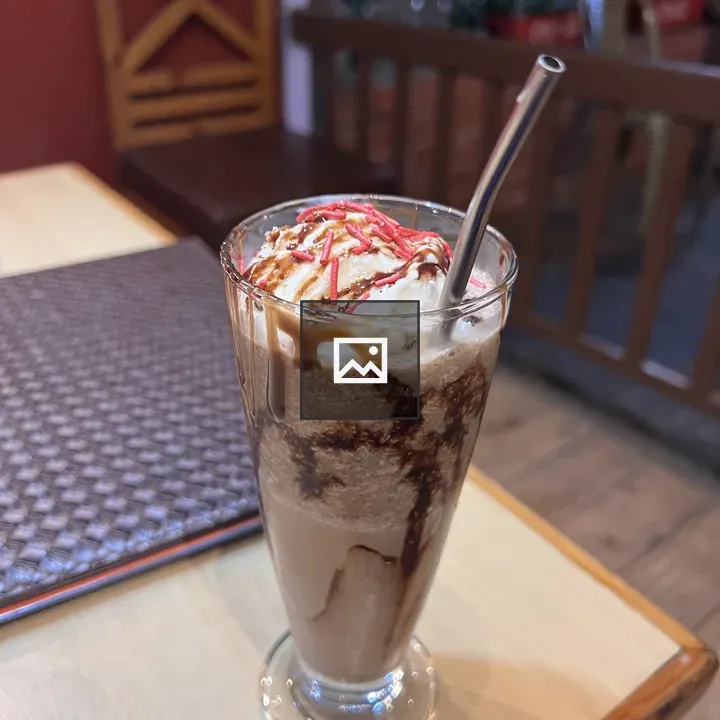 Iced chocolate drink with whipped cream