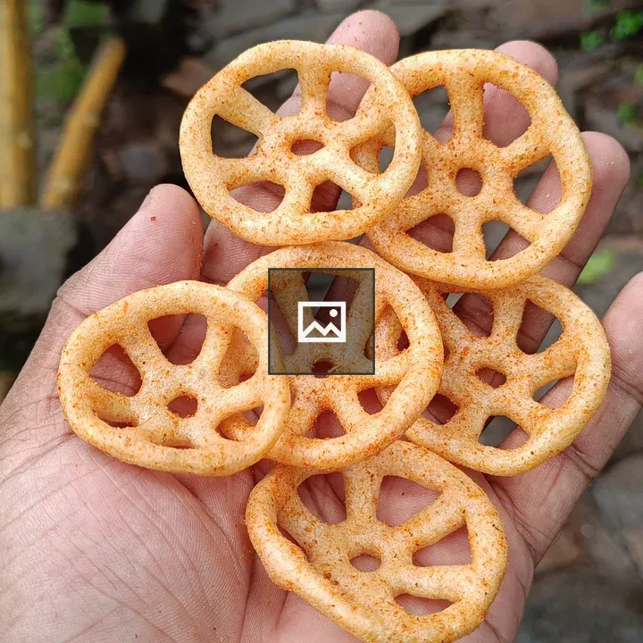 Handful of ring chips with red pepper