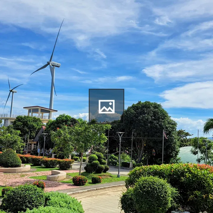 Wind Turbines Over Landscape Garden
