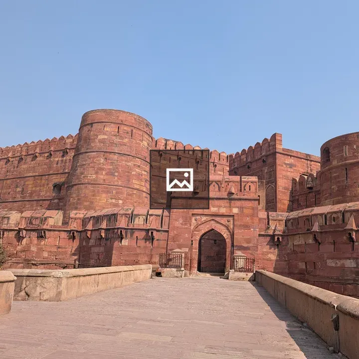 Red sandstone fort with walls and gateway