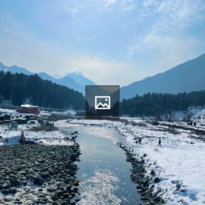 Snow-covered valley with river