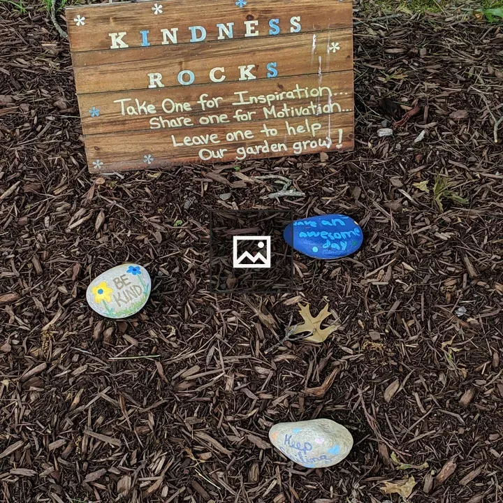 Kindness rocks on the sidewalk
