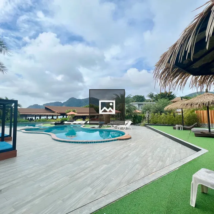 Resort area with pools and palm trees