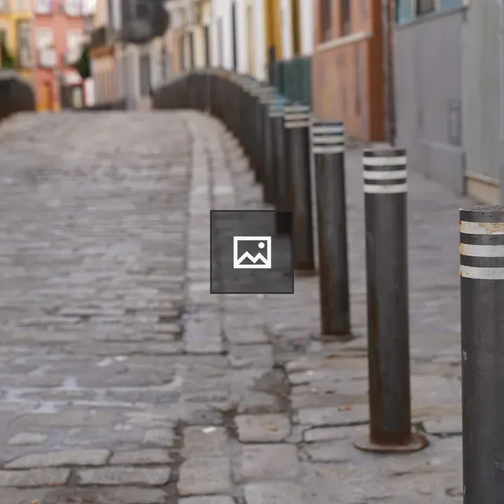 Parking barriers on sidewalk