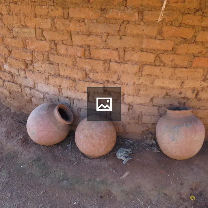 Clay Pots at Mud-Brick Wall