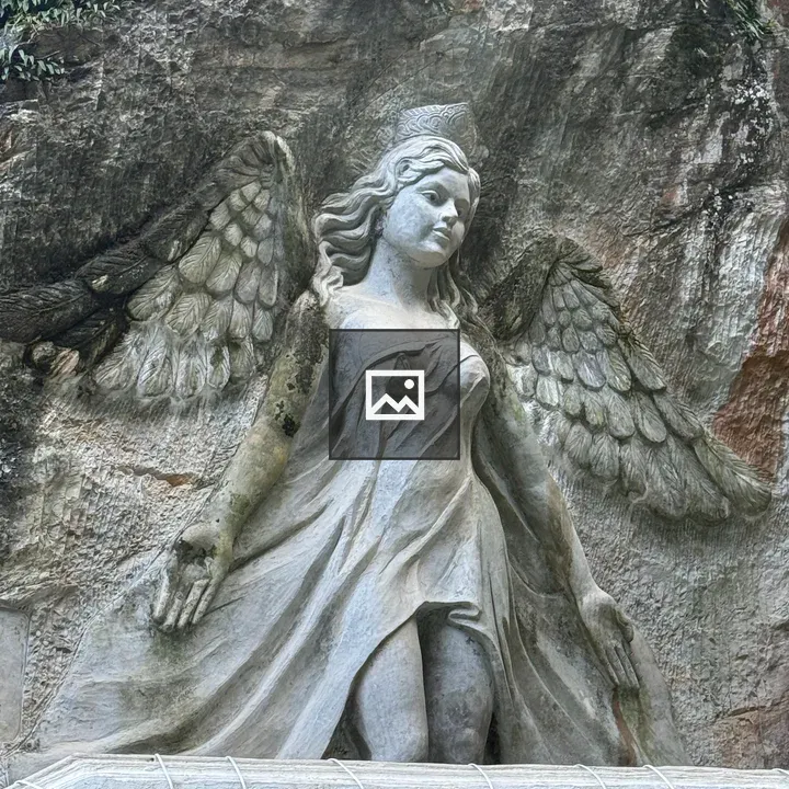 Stone angel relief on rock face