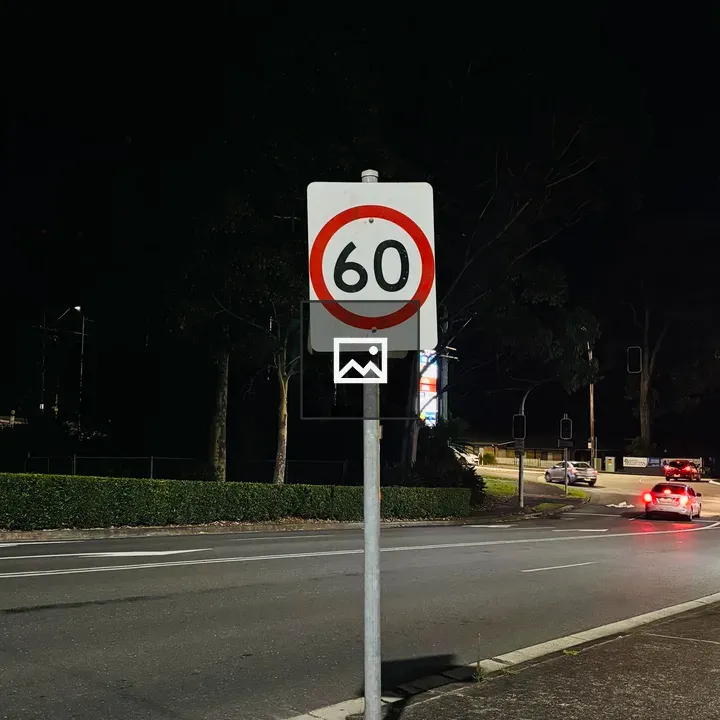 Traffic signal at night showing 60