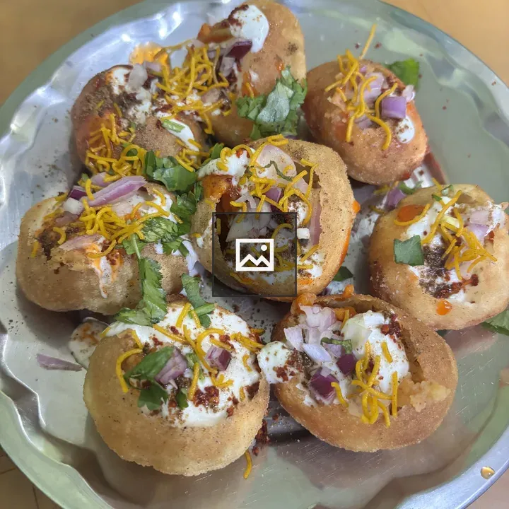 Dahi puri on a silver plate