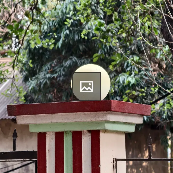 Round light globe on striped pillar