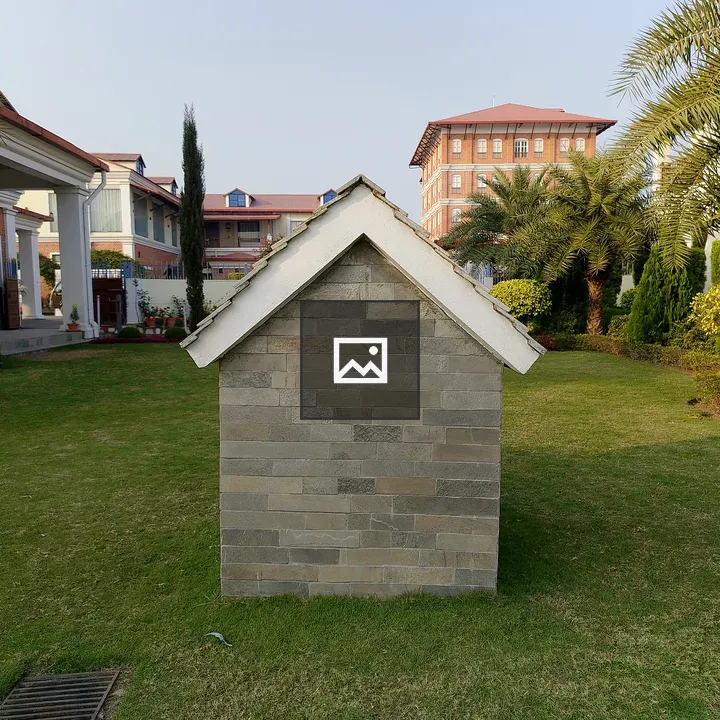 Stone-clad house with peaked roof