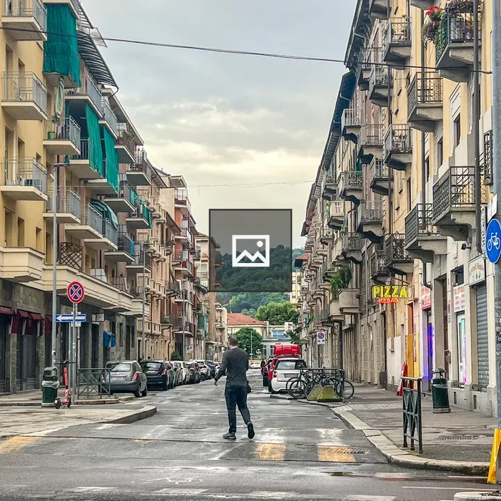 Man walking down Torino street