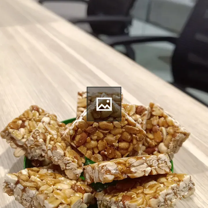 Peanut chikki in green jar cap