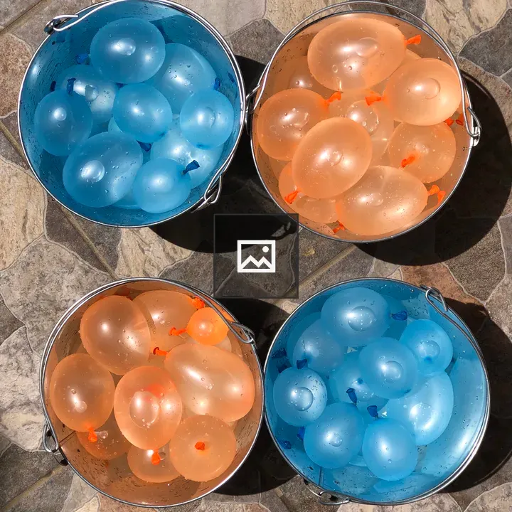 Water balloon buckets on stone
