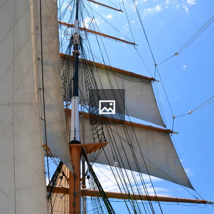 Pirate Ship Sails Against Blue Sky