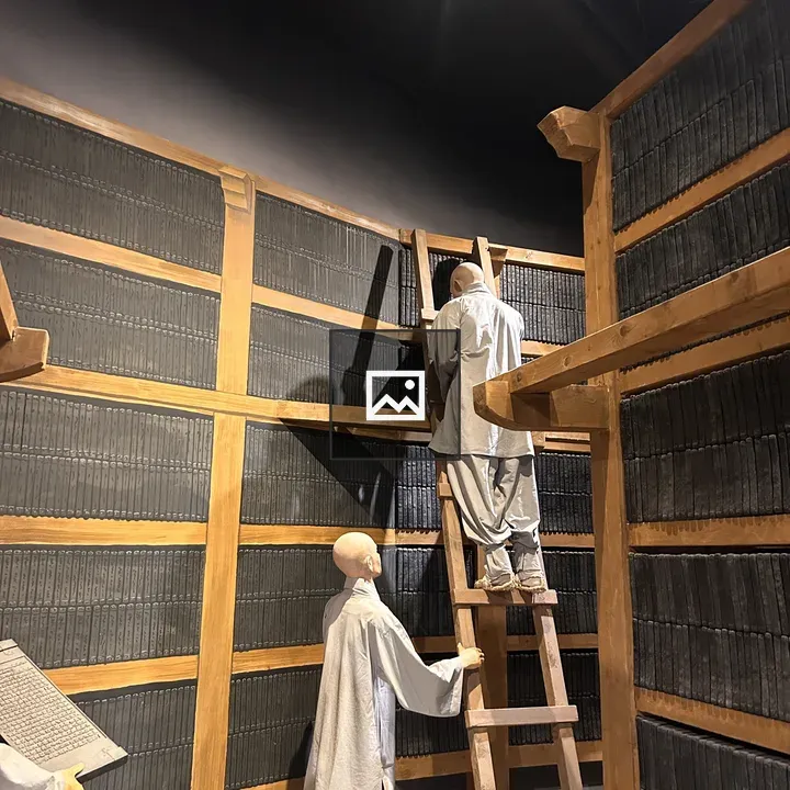 Two Humanoid Figures in Dim Room