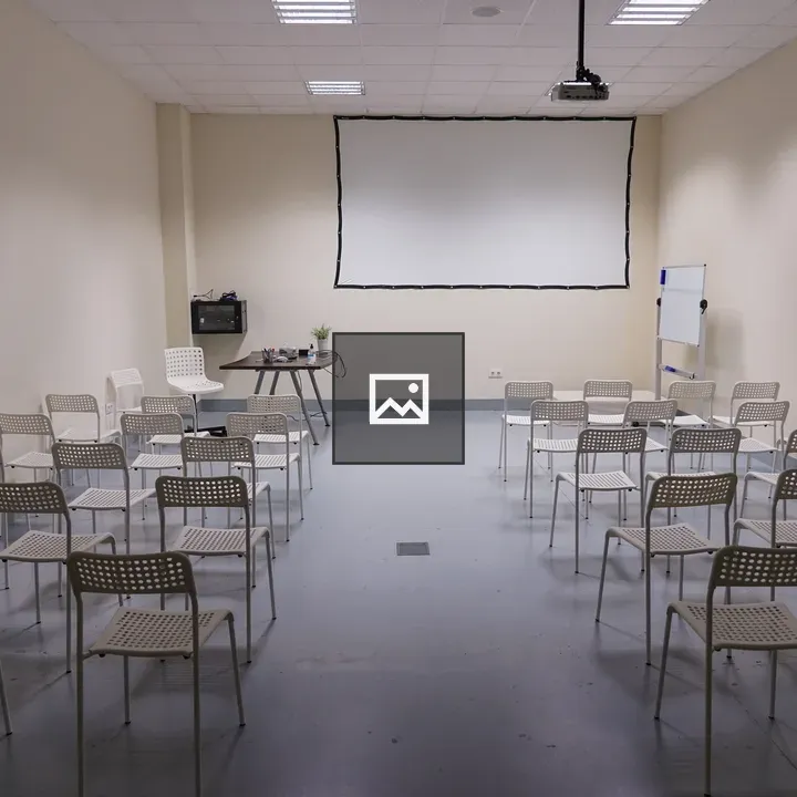 Conference room with white chairs