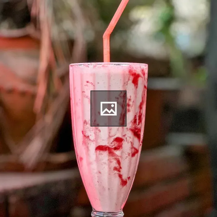 Strawberry smoothie with straw