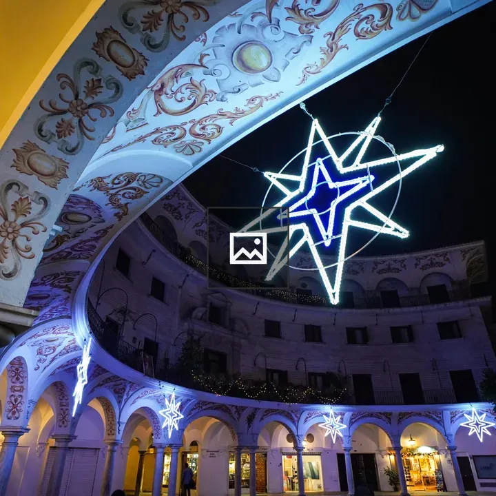 Nighttime ornate plaza arches
