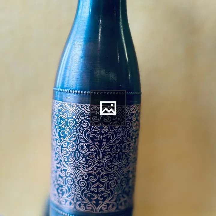 Blue copper bottle on table