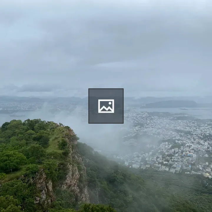 City and lake with mist