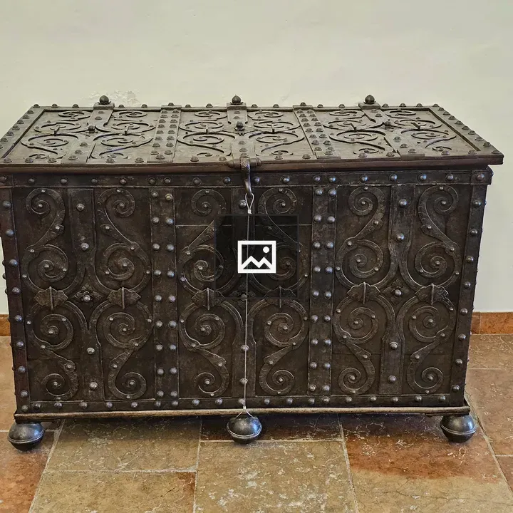 Antique metal chest with ornate designs