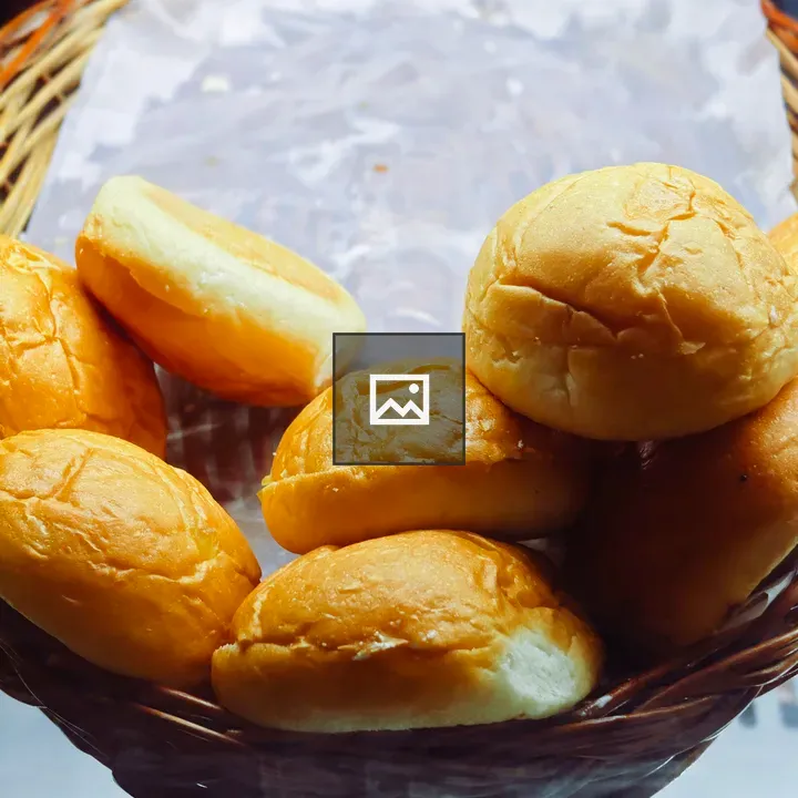 Woven basket with bread rolls