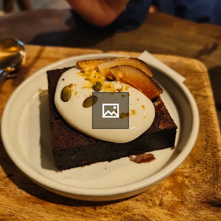 Brownie with cream and zest