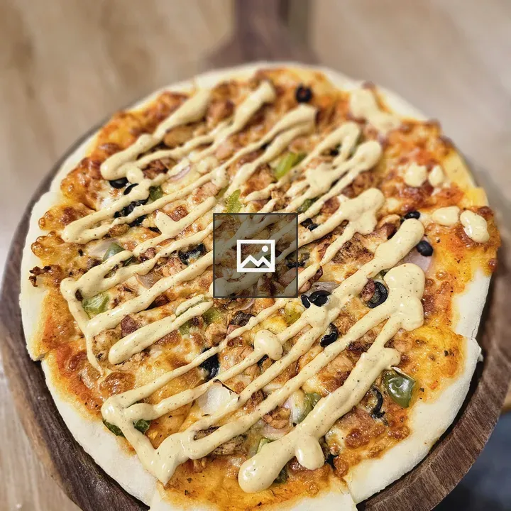 Fusion pizza on wooden board