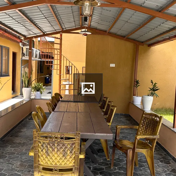 Outdoor dining area with long wooden table