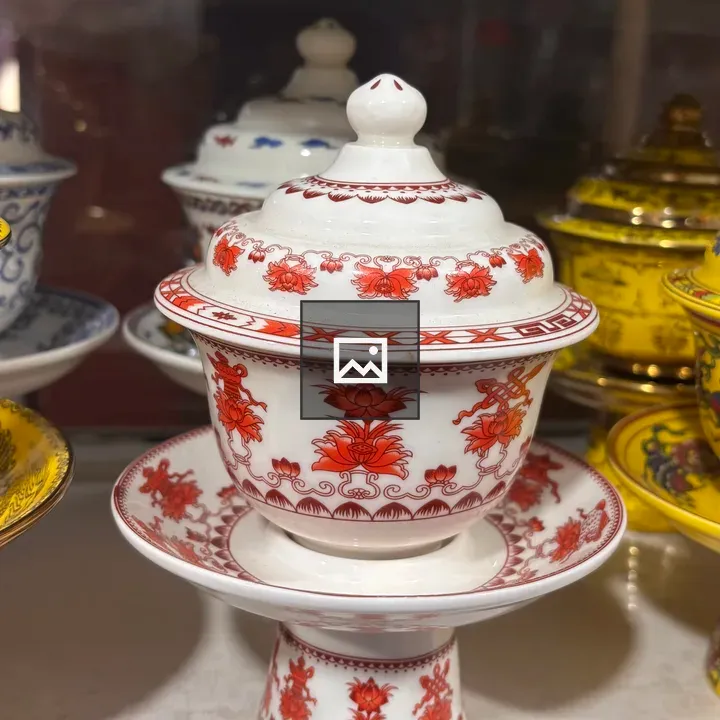 Porcelain teacup with lid and saucer