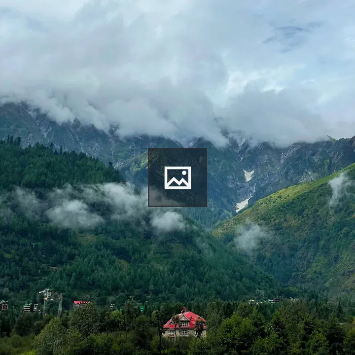 Red Roofed Building in Foggy Valley
