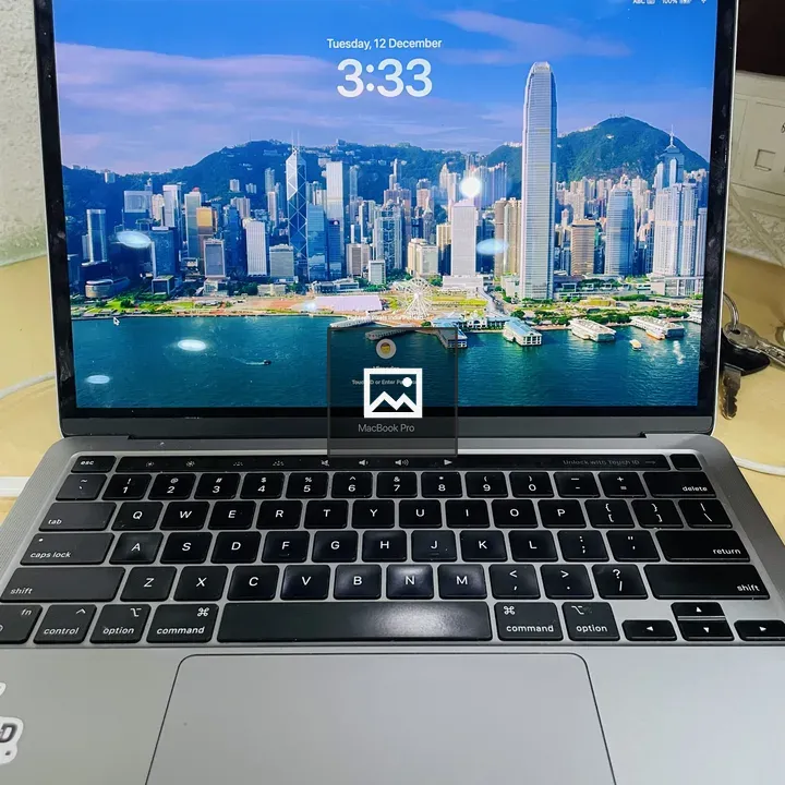 MacBook Pro on Desk with City Wallpaper
