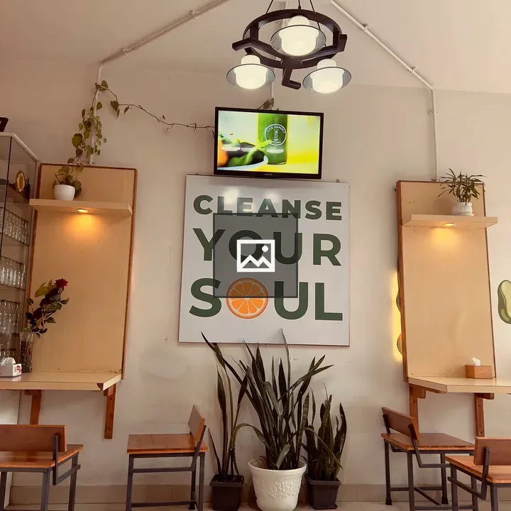 Cafe interior with sign and plants