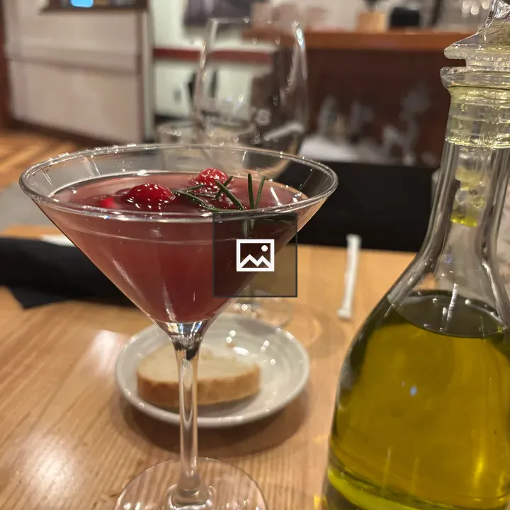 Pink cocktail in martini glass