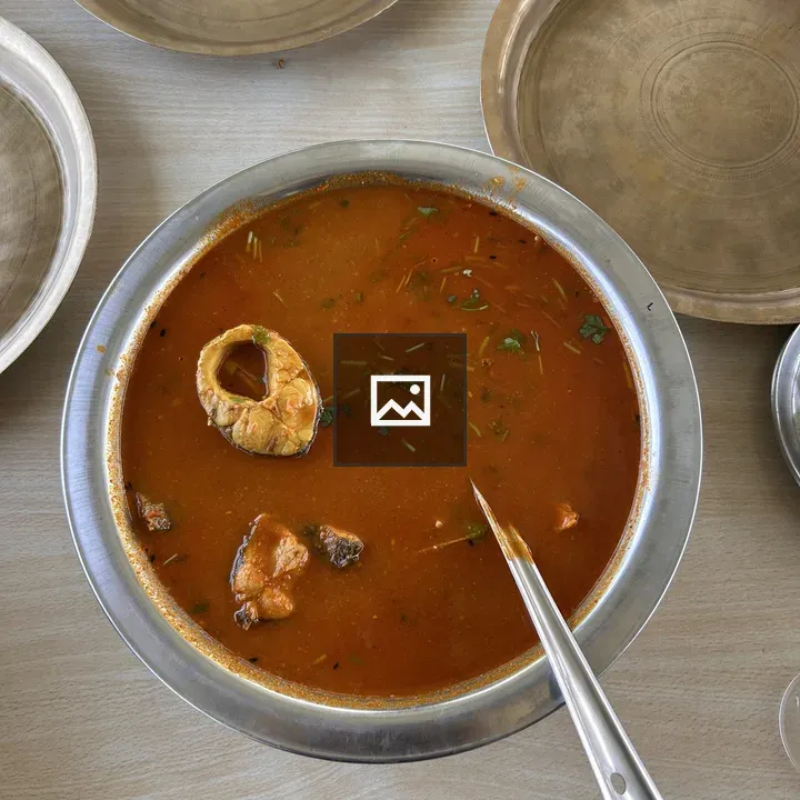 Fish soup in circular steel bowl