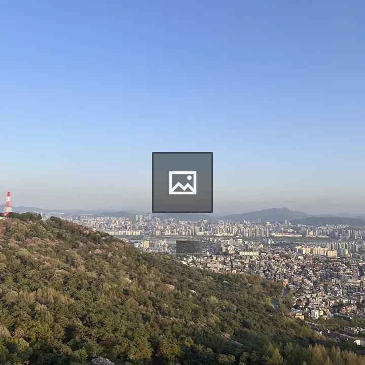 City Skyline with Green Hills