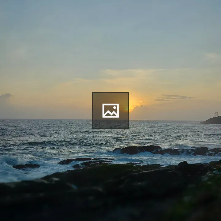 Sun and waves over rocks at shore