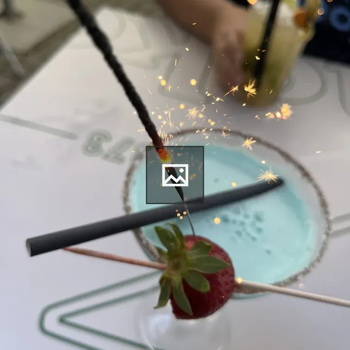 Sparkler in a Blue Hawaiian beverage