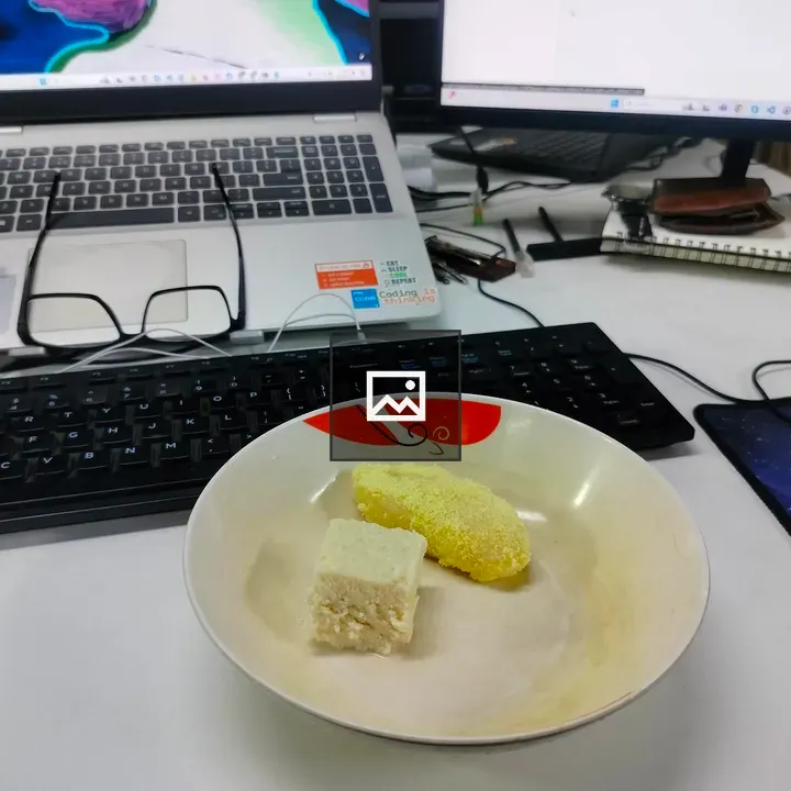 Bowl with Two Food Pieces on Desk