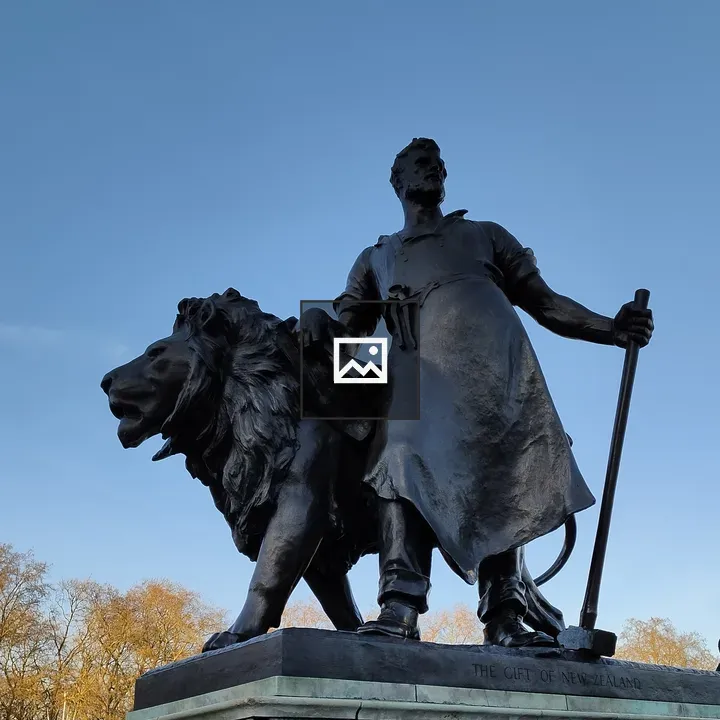 Bronze statue with staff