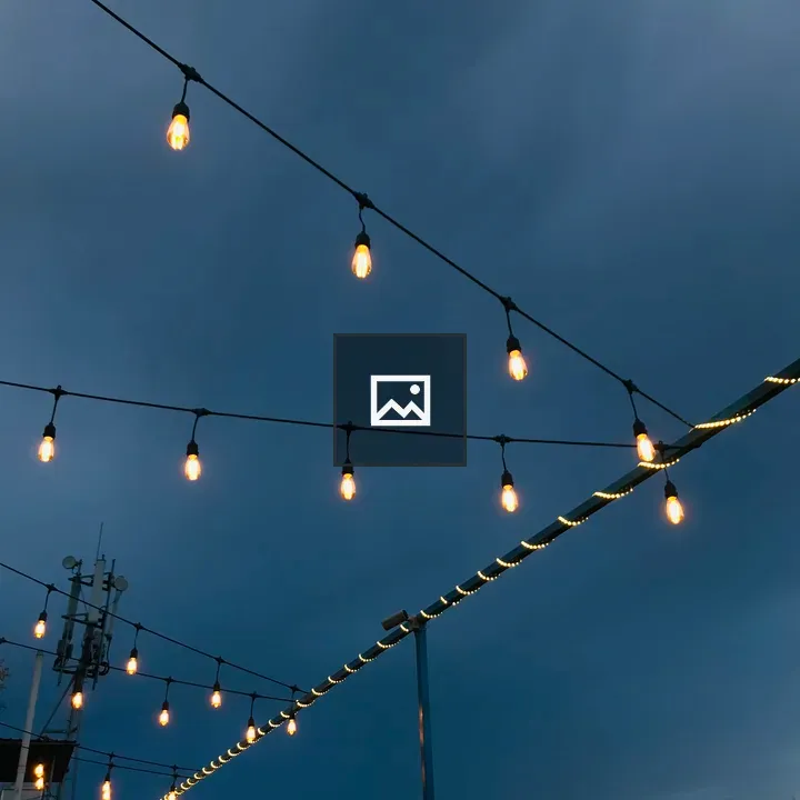 Rooftop Lights Under Night Sky