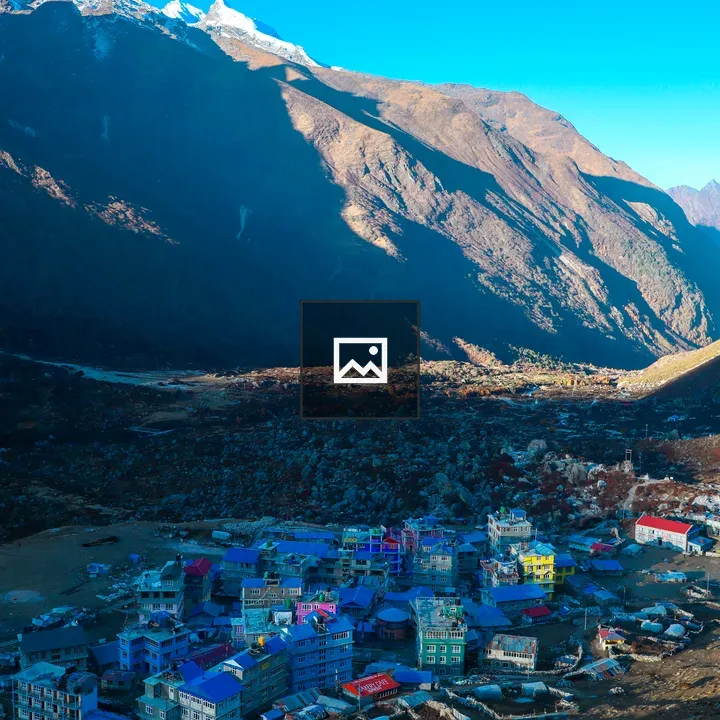 Colorful village at mountain base