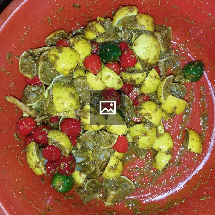 Orange bowl with chopped lemons and peppers
