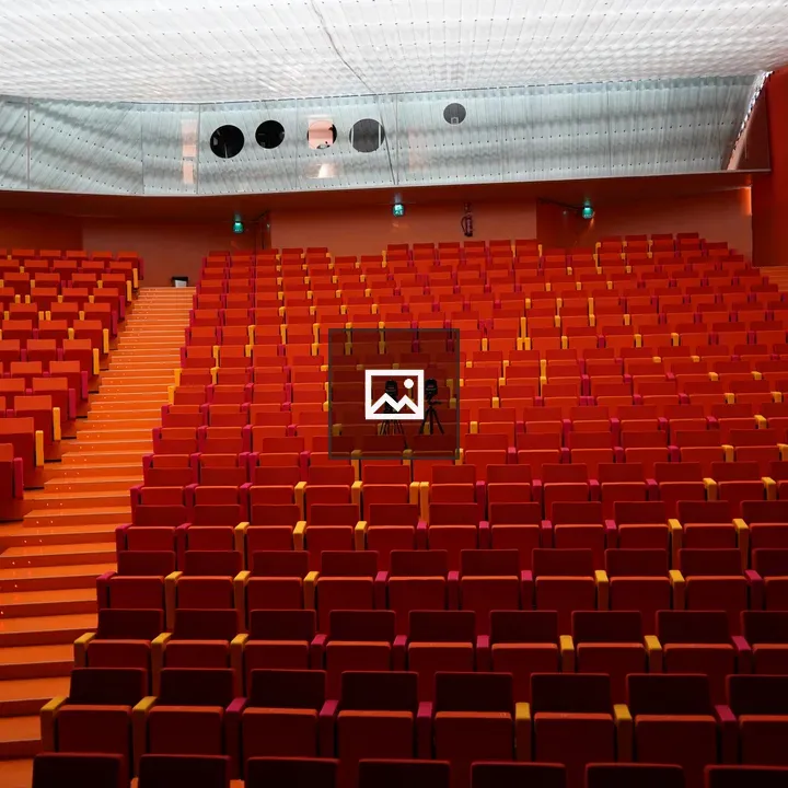 Empty auditorium with seats and cameras