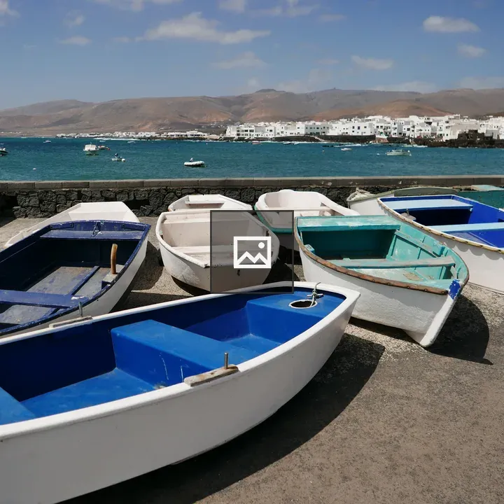 White and blue boats on a platform