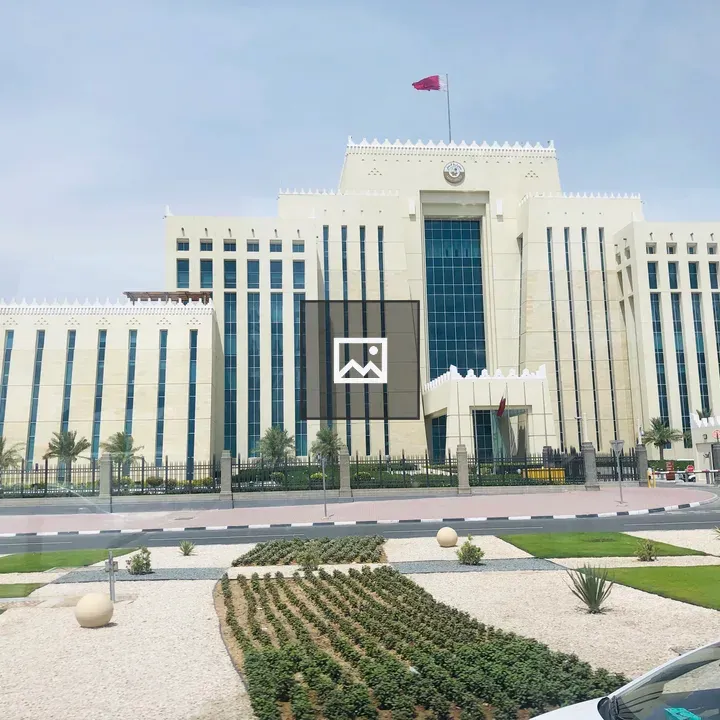 Government building with flag and landscaping