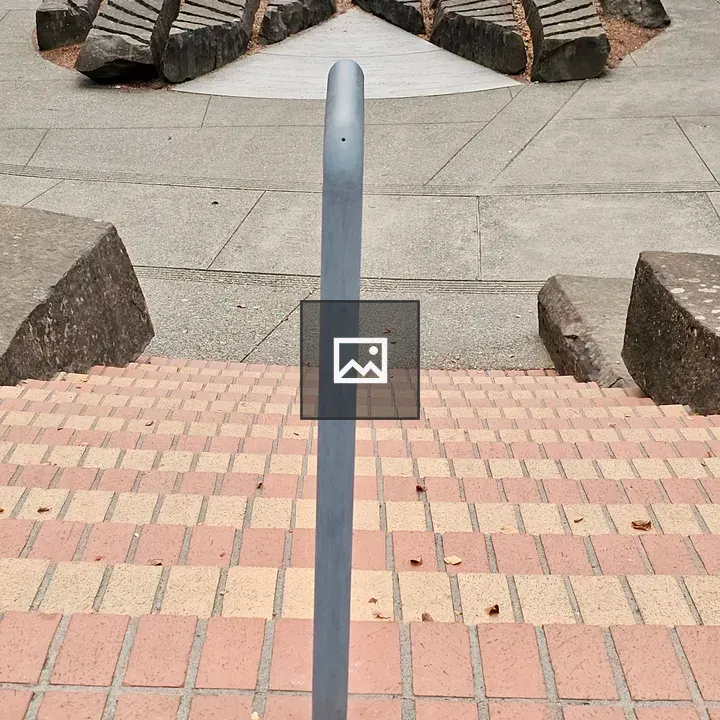 Bricks stairs and sundial-like stone art